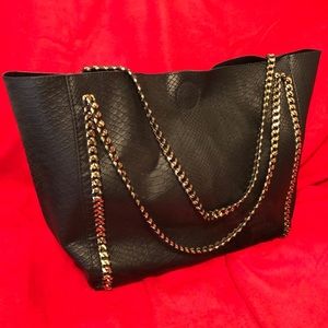 Black leather bag with gold details